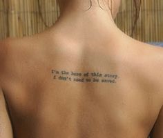 a person with a tattoo on their back saying i'm the hero of this story, i don't need to be saved