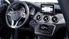 the interior of a mercedes c - class car with electronic controls and steering wheel control