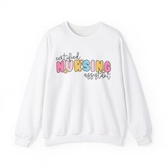 Get ready to be OBSESSED with your CNA sweatshirt. It's the cutest and most trendy way to emit all those CNA vibes! This is THE CUTEST CNA sweatshirt! Great as a CNA gift! * Q U I C K * F A C T S * ✺ 100% preshrunk cotton ✺ Wash and dry normally (on cool for best results) * S I Z I N G * ✺ Models are wearing size XL for an oversized look ✺ Sizing is unisex so runs like men's, though not overly large ✺ Most women find their typical size works best, since they are meant to fit a touch loose ✺ Size guide and fit is included in the listing photos * S H I P P I N G * T I M E S * ✺ Our items are individually made with love for each of our buyers. Because of this, our processing time is 2-5 business days (depending on order volume) plus transit time, but typically much faster. We know our custome White Fleece Sweatshirt With Letter Print, Cute Text Print Sweatshirt For Fall, Cute Sweatshirt With Text Print And Long Sleeves, Cute Fleece Sweatshirt With Letter Print, Cute Long Sleeve Sweatshirt With Text Print, Cute Oversized Slogan Sweatshirt, Cute Relaxed Fit Sweatshirt With Letter Print, Cute Crew Neck Sweatshirt With Ribbed Cuffs, Cute Letter Print Sweater For Loungewear