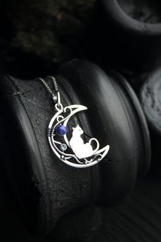 ITEM DESCRIPTION: The size of this moon pendant H 4 cm x W 3 cm. Weight - 4g. You can buy this necklace with a chain or without. Jewelry will come to you in a gift box - ready for gift giving. I made this moon phases necklace of sterling silver, Lapis lazuli, and topaz London. It looks like a real magic art. The handmade silver pendant with the cat will be a great gift for cat lovers. The parcel will be sent during 1-2 days after payment. Delivery usually takes 10-21 days. But in the period from Cat Design Round Pendant Jewelry Gift, Moon-shaped Necklace With Large Pendant For Gift, Moon Shaped Necklace With Large Pendant For Gift, Sterling Silver Cat Design Pendant Necklace, Cat Design Pendant Jewelry, Hammerhead Shark Necklace, Ursula Jewelry, Cat And Moon, Moon Necklace Silver