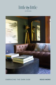 a living room filled with furniture and books on top of a coffee table next to a couch