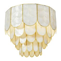 an art deco chandelier with white and gold leaf design on the bottom half