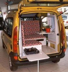 the back end of a small van with its door open