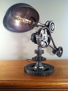 an antique desk lamp on top of a wooden table