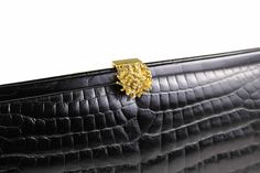 Adorable vintage DOFAN black clutch handbag. Frame bag with flower shaped snap closure decorated with inlaid transparent strass stones. The interior is lined in champagne-color satin fabric, and has two pockets, one with a zipper. Dimensions: Height: 15.00 cm. | Width: 30.50 cm. | Depth: 5.00 cm. | Condition: NEAR MINT More vintage handbags in my online shop: http://www.vintagecarwen.com Formal Evening Pouch Bag With Magnetic Closure, Formal Evening Bag With Magnetic Closure, Elegant Pouch Clutch With Magnetic Closure, Elegant Evening Bag With Magnetic Closure As Gift, Gold Evening Bag With Magnetic Closure For Formal Occasions, Elegant Clutch With Magnetic Closure, Elegant Gold Evening Bag With Magnetic Closure, Black Leather Handbag, Frame Bag