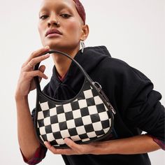 Find COACHTOPIA Ergo Bag In Checkerboard Upcrafted Leather on Editorialist. The Coachtopia Ergo is a shoulder bag that reimagines an iconic 90s silhouette from Coach's archives. This version is crafted in checkerboard patchwork Upcrafted™ leather, a unique artisanal material made by sewing together squares of scrap leather left over from the production of Coach leather goods. It can be worn on the shoulder, hand carried, or worn crossbody. Checkered Bag Outfit, Coachtopia Ergo, 90s Silhouette, Purses Black, Sling Bag Mini, Iconic 90s, Dopamine Dressing, Sustainable Bag, Leather Scraps