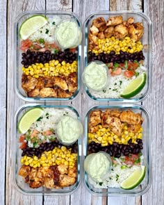 four plastic containers filled with food on top of a white wooden table next to lime wedges