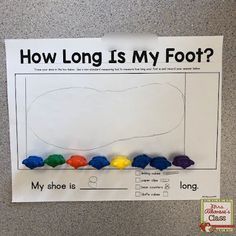 a bulletin board with the words, how long is my foot? and four colored rocks