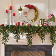 a mantel decorated with christmas decorations and candles