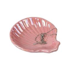 a pink shell shaped dish with a chain on it