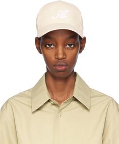 Cotton twill cap in off-white. · Embroidered eyelets at crown · Logo embroidered at face · Curved brim · Logo embroidered at back face · Cinch strap Supplier color: Ecru Classic Cream Baseball Cap With Curved Visor, Classic Cream Baseball Cap For Spring, Classic Snapback Hat With Curved Brim For Spring, Classic Spring Snapback Hat With Curved Brim, Cream Snapback Baseball Cap For Spring, Cream Curved Brim Trucker Hat For Spring, Cream Trucker Hat With Curved Brim For Spring, Beige Snapback Baseball Cap For Spring, Spring Beige Snapback Baseball Cap