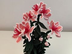 pink and white flowers in a green vase