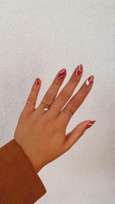 Almond Nails To Go With Red Dress, Red And White Oval Nails, Simple Red Nails Designs, Acrylic Red Nails Design, Red Patterned Nails, Dip Red Nails, Red Squiggle Nails, Fun Red Nail Designs, Red Nails With White Design