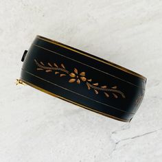 A very nice vintage Victorian Revival black enamel clamper bracelet estimated to date from the 1960s.�  It is 1 inch wide, 2 1/4 inches side to side, and 2 inches front to back.The condition is good. The clasp works well, and it has a safety chain. There is light wear consistent with age. There is no metal decay and no obvious cracks on the enamel.&nbsp; Victorian Revival, Safety Chain, Vintage Victorian, The 1960s, Vintage Costume Jewelry, Lighted Signs, Black Enamel, Vintage Costumes, Best Part Of Me