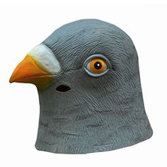 a bird mask with an orange beak and yellow eyes on it's head is shown