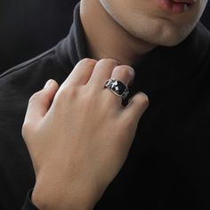 Dark Armor men's ring designed in sterling silver and black rhodium with a black onyx center stone. Black Stainless Steel Ring With Polished Finish, Formal Black Stainless Steel Signet Ring, Black Stainless Steel Skull Ring As Gift, Black Stainless Steel Skull Ring For Gift, Gothic Black Stainless Steel Rings, Black Gothic Stainless Steel Skull Ring, Elegant Black Skull Ring In Sterling Silver, Elegant Black Sterling Silver Skull Ring, Black Enamel Sterling Silver Signet Ring