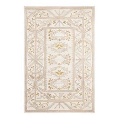 a white and gold rug with an intricate design on the bottom, in front of a white background