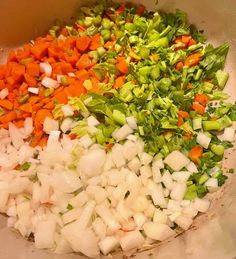 chopped vegetables are in a bowl on the table