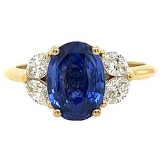 This gorgeous diamond 3-stone ring set in an 18ct yellow gold setting, with 4 natural marquise cut diamonds and oval shape sapphire. This is a unique and eye-catching ring. Total Diamond Weight: 0.53ct Diamond Colour: H Diamond Clarity: SI1 Total Sapphire Weight: 2.87ct Total Weight: 3.9g Ring Size: M1/2 Width of Band: 1.86mm Width of Head: 9.52mm Length of Head: 13.64mm SMS9440 Please note most of our rings can be sized for an additional charge. All resized rings are non-refundable. Gia Certified Oval Gold Sapphire Ring, Three Stone Oval Cluster Ring In Yellow Gold, Oval Sapphire Yellow Gold Wedding Ring, Oval Sapphire Three-stone Diamond Ring, Oval Sapphire Three Stone Diamond Ring, Classic Yellow Gold Marquise Sapphire Ring, Heirloom Oval Sapphire Three-stone Ring, 3 Stone Diamond Ring, Brilliant Cut Diamond Ring