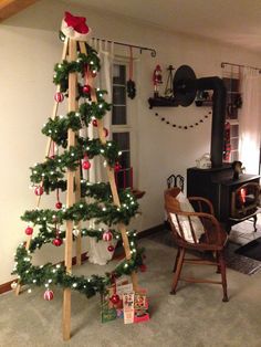 a christmas tree is decorated with red and white ornaments