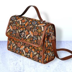 "Cottagecore Hippies Daisy floral Canvas Satchel bag, Cute women boho crossed body purse, cute vegan leather strap hand bag, hippies boho gift  >>PRODUCT INFO<< * 18.94 Oz. Made from high-grade waterproof canvas, durable, water-resistant. * Can be used as a nice laptop storage bag, business briefcase, college school bag, leisure travel tote bag, crossbody messenger bag, card wallet case, etc. * Two interior pockets for small items one zipper pocket. * Removable and adjustable shoulder strap. * T Bohemian Shoulder Satchel, Floral Print Satchel Shoulder Bag As Gift, Retro Satchel With Adjustable Strap As Gift, Hippie Brown Shoulder Bag For Daily Use, Bohemian Brown Handheld Satchel, Brown Hippie Shoulder Bag For Daily Use, Brown Floral Print Bag For Everyday Use, Brown Hippie Shoulder Bag With Adjustable Strap, Brown Floral Print Shoulder Bag For Daily Use