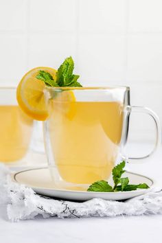 two glasses of lemon tea on a plate