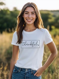 The Thankful T-Shirt is a perfect addition to your holiday wardrobe. This rectangle-shaped shirt features a heart with a thankful message, making it a great way to show your gratitude and celebrate Thanksgiving. Made of soft, comfortable fabric, this shirt is a must-have for the holiday season. Unisex Sizing 100% Cotton Thankful Message, Holiday Wardrobe, A Heart, The Holiday, Gratitude, Graphic T Shirt, Holiday Season, Graphic Tshirt, Thanksgiving