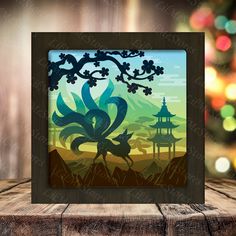 a wooden frame with an image of a bird and pagodas in the background, on top of a wood table