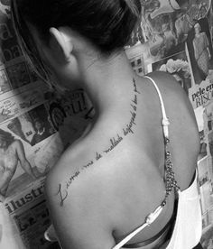 a woman with a tattoo on her back