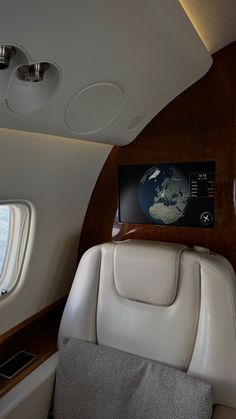 the inside of an airplane with leather seats