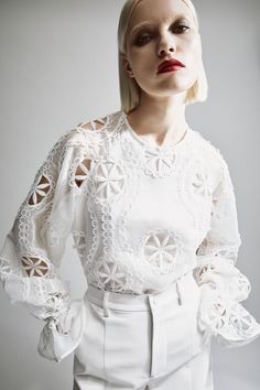 Springtime sophistication. The Rosalee Lace Blouse features an effortless relaxed fit with long volume sleeves, an elasticated frill cuff, high round neckline and allover embroidery details.SIZING: Relaxed fit. AU: Model wears a size 8 / US: Model wears a size 4.FABRICATION: Main base: 100% polyester. Main embroidery: 100% polyester. Lining: 100% cotton. Exclusive of trims.  - Volume sleeves - Elastic frill cuff - Embroidered detail Spring Long Sleeve Blouse With Set-in Sleeves, Spring Blouse With Set-in Sleeves, Spring Bishop Sleeve Blouse With Elastic Sleeves, Spring Blouse With Bishop And Elastic Sleeves, Chic Blouse With Blouson Sleeves And Crew Neck, Chic White Bishop Sleeve Blouse, Chic White Blouse With Bishop Sleeves, Fall White Blouse With Elastic Sleeves, Elegant White Blouse With Elastic Sleeves