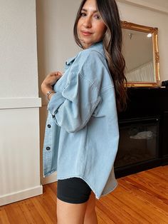 No matter what you're up to, the Chill Outing Blue Shaket will keep you lookin' ultra-cute and classic all day long! Sturdy light blue wash denim shapes this lightweight jacket that features a classic collared neckline framed by long sleeves with drop shoulders and button cuffs. The slightly oversized bodice boasts that continues down to the rounded hem. Light Denim Blue Relaxed Fit 100% Cotton Shacket/Jacket Trendy Collared Light Wash Denim Jacket, Everyday Light Wash Collared Denim Jacket, Medium Wash Relaxed Fit Outerwear For Day Out, Relaxed Fit Medium Wash Outerwear For Day Out, Light Wash Denim Collared Outerwear, Light Wash Collared Denim Jacket For Everyday, Light Wash Collared Denim Outerwear, Casual Light Blue Button-up Denim Jacket, Light Wash Cotton Denim Jacket For Day Out