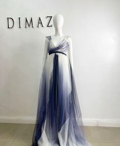 Indulge in timeless elegance with our blue and white long flowy tulle dress. Crafted with ethereal layers of tulle, this dress exudes grace and sophistication. The delicate blue and white hues blend seamlessly, creating a mesmerizing ombré effect. Its flowing silhouette dances with every step, while the fitted bodice accentuates your curves. Perfect for formal events or a romantic evening, this dress will make you feel like a true goddess. DETAILS Polyester fabric Zip closure Flowy skirt Fitted top Dry clean Ready to ship in the measurements below! length 65” Underbust 26” Bust 31” Size S Flowy Tulle Dress, Book Outfits, African Suit, Walking Sticks And Canes, Belted Pants, Romantic Evening, Ombre Effect, Skirt Fits, Fitted Top