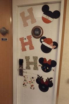 the door is decorated with mickey mouse magnets