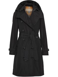 Kensington hooded trench coat from BURBERRY featuring black, detachable hood, belted waist, double-breasted button fastening, belted cuffs, two side slit pockets and central rear vent. | Burberry Kensington hooded trench coat Burberry Raincoat, Burberry Outfit, Hooded Trench Coat, Burberry Trench Coat, Hooded Raincoat, Trench Coat Black, Trench Coats Women, Burberry Women, Coat Black