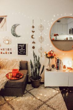 a living room filled with lots of furniture next to a wall covered in lights and decorations