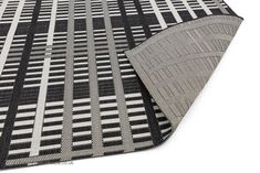 a black and white rug with lines on it