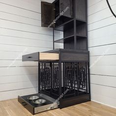 a dog food dish is on the floor next to a book shelf and cabinet with drawers