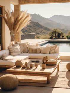 a living room filled with furniture next to a swimming pool