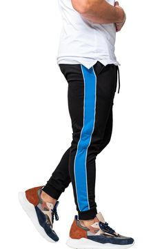 Athleisure is reinvented in these comfy joggers that leave others in the dust with supersoft fleece, bold side stripes and a skinny fit. Elastic/drawstring waist Front scoop pockets 92% cotton, 8% elastane Hand wash, dry flat Made in Turkey Sporty Blue Activewear With Elastic Side Panels, Blue Sporty Activewear With Elastic Side Panels, Stretch Sweatpants With Side Stripes For Jogging, Sporty Joggers With Ribbed Cuffs For Streetwear, Sporty Sweatpants With Elastic Side Panels For Workout, Sporty Sweatpants With Athletic Fit, Stretch Joggers With Side Stripes For Jogging, Stretch Pants With Side Stripes For Jogging, Cotton Sweatpants With Side Stripes For Jogging