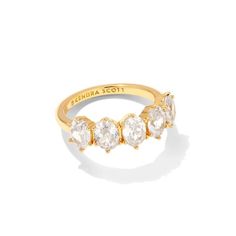 Pictured on a white background is a gold ring with five oval, clear crystals. Kendra Scott Store, Jewelry Kendra Scott, Giddy Up Glamour, Cubic Zirconia Rings, Gold Crystal, Kendra Scott Jewelry, Crystal Shop, White Crystal, Brass Material