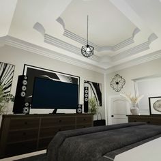 a living room filled with furniture and a flat screen tv on top of a wooden dresser