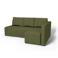 a green couch sitting on top of a white floor