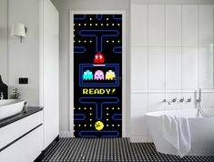 an image of a bathroom scene with pacman door stickers