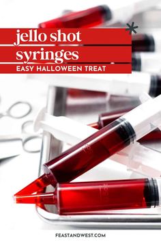 some red pens and scissors on top of a white surface with the words jello shot syrings easy halloween treat