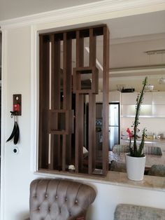 a living room filled with furniture and a potted plant