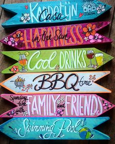 four wooden signs with different sayings are stacked on top of each other in the shape of surfboards