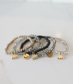 Add some bling to your wrist with our Personalized Crystal Stacks! You can personalize your stack bracelet with a name, date, initials, or a word of choice on a simple, classic disc charm. With neutral colors and faceted beads that shine and shimmer in the light, you can be reminded of a motivating word, memory, or special loved one whenever you look down at your wrist! A perfect gift for the everyday stack wearing lover! *Elastic stack bracelets are made with 6mm faceted crystals *Personalized Classic Personalized Beaded Bracelets For Everyday, Adjustable Hand Stamped Charm Bracelet For Everyday, Everyday Adjustable Hand Stamped Charm Bracelet, Black Hand Stamped Jewelry For Everyday, Black Hand Stamped Everyday Jewelry, Silver Beaded Bracelet With Custom Name For Everyday, Stack Bracelets, Stack Bracelet, Chosen Family