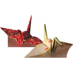 two origami cranes sitting side by side on top of each other in red and white