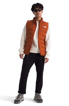 Experience the core warmth you need without restricting mobility in a lightweight puffer vest insulated with a blend of down and recycled polyester. 28" length (size Medium)   Stand collar   Lined   100% recycled polyester   Machine wash, tumble dry   Imported Puffer Vest, Stand Collar, North Face, The North Face, Puffer, Nordstrom, Copper, Size Medium, Luxury Fashion